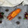 Cooked Australian Rock Lobster with Christmas decoration in Singapore (flatlay).