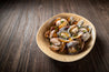 Boiled Short Neck Clams (Asari) in bowl on wooden table